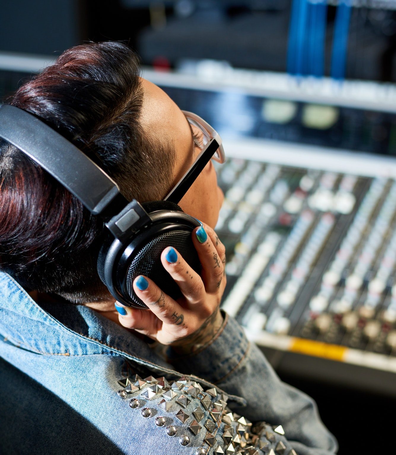 producer listening to audio track in studio PY297D6